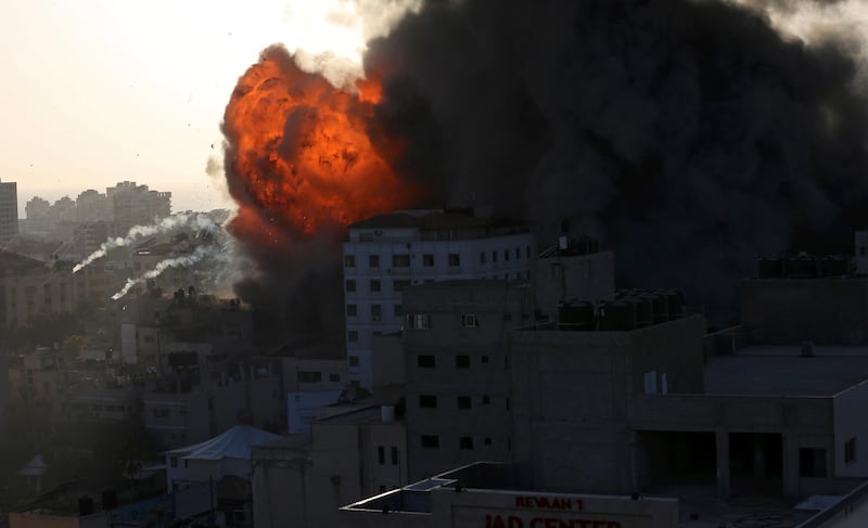 Smoke and flames from an Israeli air strike on a building in Gaza City. AP