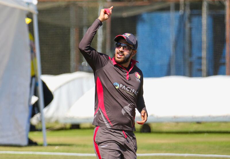The UAE's Chirag Suri celebrates taking a catch to dismiss Michael Leask.