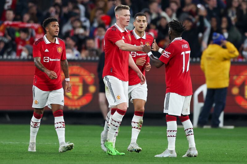 Manchester United's Scott McTominay, centre, is congratulated by teammates after scoring his team's first goal. AP