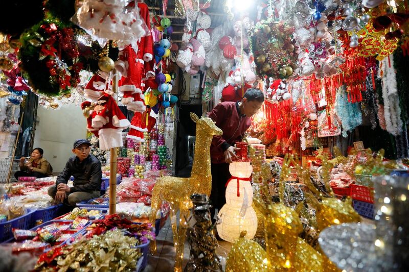 Christmas decorations are for sale at a shop on a street in Hanoi, Vietnam.  EPA