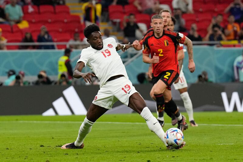 Canada's Alphonso Davies tries to control the ball. AP 