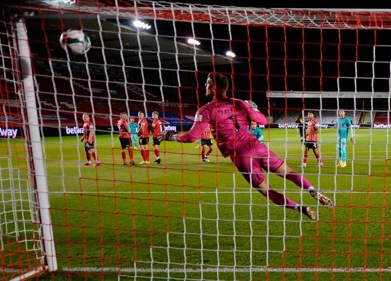 Lincoln City's goalkeeper Alex Palmer concedes the opening goal. EPA
