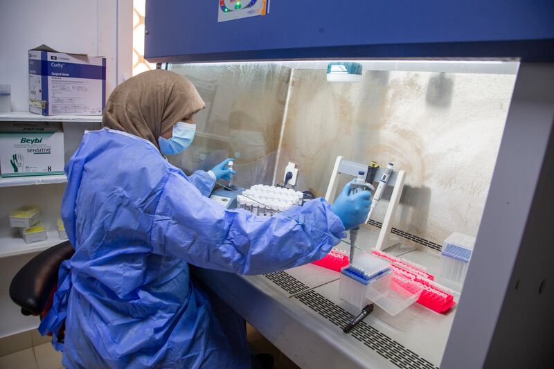 A health worker wearing protective gear works at a Covid-19 testing centre in Misrata, Libya. AP