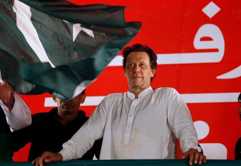 FILE - In this July 21, 2018, file photo, Pakistani politician Imran Khan, chief of Pakistan Tehreek-e-Insaf party, arrives to address an election campaign rally in Islamabad, Pakistan. The Taliban say they are holding "another" meeting on Monday, Dec. 17, 2018 with U.S. officials, this time in the United Arab Emirates and also involving Saudi, Pakistani and Emirati representatives in the latest attempt to bring a negotiated end to Afghanistan's 17-year war. (AP Photo/Anjum Naveed, File)