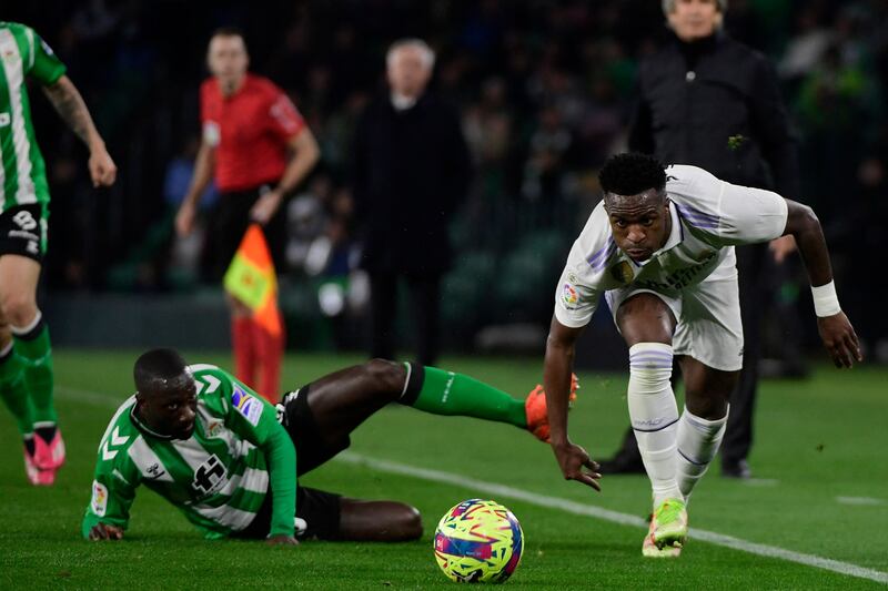 Real Betis defender Youssouf Sabaly vies with Real Madrid's  Vinicius Junior. AFP