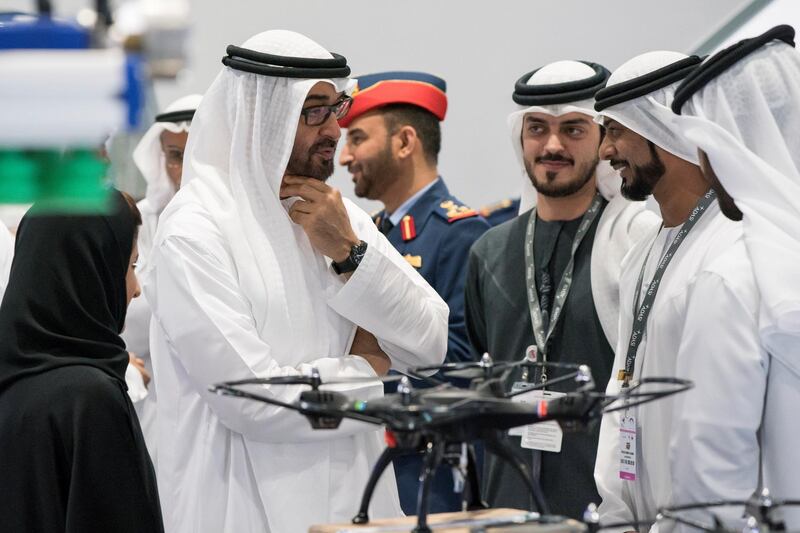 ABU DHABI, UNITED ARAB EMIRATES - February 27, 2018: HH Sheikh Mohamed bin Zayed Al Nahyan, Crown Prince of Abu Dhabi and Deputy Supreme Commander of the UAE Armed Forces (L), visits the ACTVET (Abu Dhabi Centre for Technical and Vocational Education and Training) stand while touring the Unmanned Systems Exhibtion and Conference (UMEX) 2018 at the Abu Dhabi National Exhibition Centre (ADNEC). 
( Ryan Carter for the Crown Prince Court - Abu Dhabi )
---