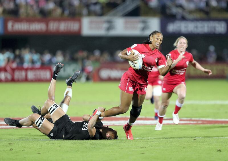 Dubai, United Arab Emirates - December 07, 2019: Charity Williams of Canada is tackled by Niall Williams of New Zealand during the match between New Zealand and Canada in the womens final at the HSBC rugby sevens series 2020. Saturday, December 7th, 2019. The Sevens, Dubai. Chris Whiteoak / The National