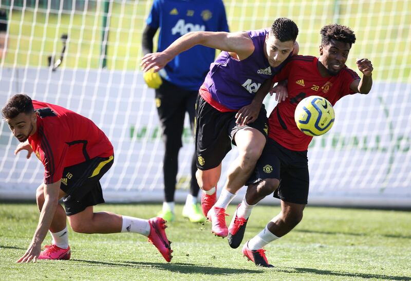 MALAGA, SPAIN - FEBRUARY 10: (EXCLUSIVE COVERAGE) Diogo Dalot and Angel Gomes of Manchester United in action during a first team training session on February 10, 2020 in Malaga, Spain. (Photo by Matthew Peters/Manchester United via Getty Images)