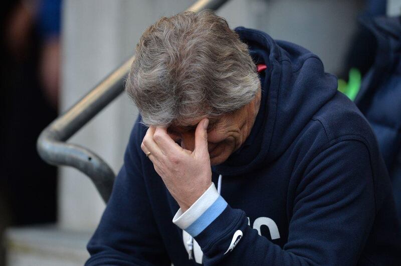 Manuel Pellegrini reacts during Manchester City's 2-1 loss to Wigan Athletic on Sunday. Paul Ellis / AFP / March 9, 2014 