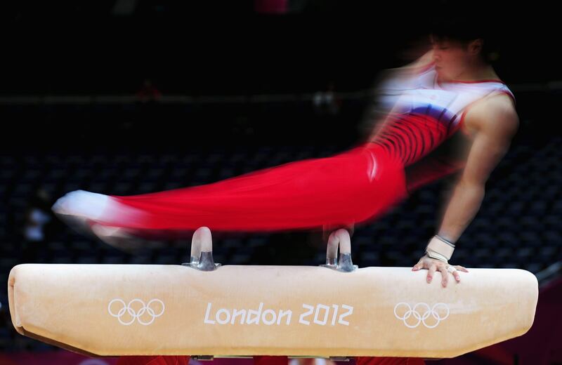 LONDON, ENGLAND - JULY 25:  A gymnast practices on the pommel horse ahead of the London Olympic Games at the North Greenwich Arena on July 25, 2012 in London, England.  (Photo by Mike Hewitt/Getty Images)