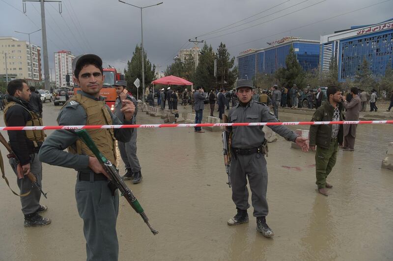 Afghan policemen keep watch at the site of a sucide attack outside a wedding hall in Kabul on November 16, 2017.
A suicide attacker blew himself up outside a wedding hall in Kabul killing at least nine people, officials said November 16, in an apparent attempt to strike a political gathering under way inside. / AFP PHOTO / SHAH MARAI