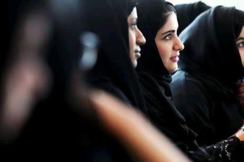 Students listen intently during a women's history class at Zayed University.
