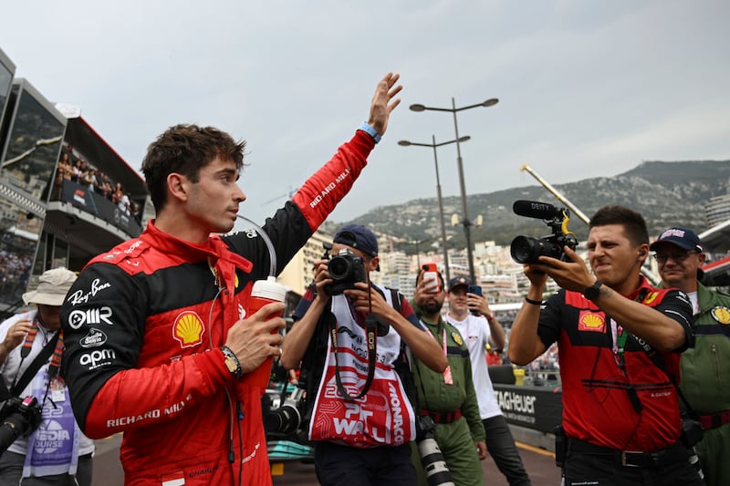 Ferrari driver Charles Leclerc of Monaco celebrates after setting the pole position in the qualifying session at the Monaco racetrack on Saturday, May 28, 2022. AP