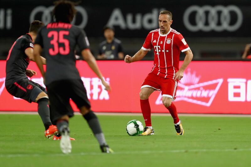 Bayern Munich's Franck Ribery takes on the Arsenal defence. Alexander Hassenstein / Getty Images