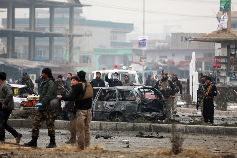 Afghan security personnel inspect the site of a bombing attack in Kabul, Afghanistan. The strong car bomb explosion rocked the capital Kabul city on Sunday morning, killing multiple people, said a government official. AP Photo