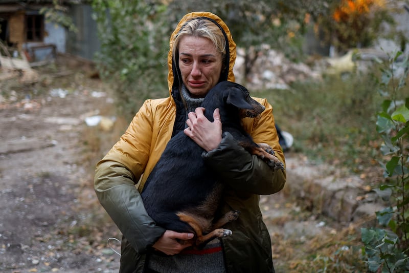 A woman walks past the site of a Russian missile strike in the southern Ukrainian city of Mykolaiv. Reuters