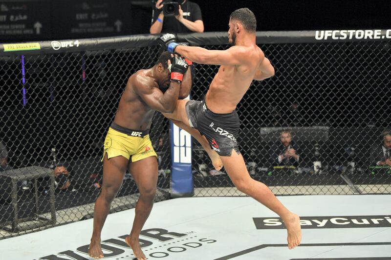 ABU DHABI, UNITED ARAB EMIRATES - JULY 16: (R-L) Mounir Lazzez of Tunisia throws a flying knee against Abdul Razak Alhassan of Ghana in their welterweight fight during the UFC Fight Night event inside Flash Forum on UFC Fight Island on July 16, 2020 in Yas Island, Abu Dhabi, United Arab Emirates. (Photo by Jeff Bottari/Zuffa LLC via Getty Images)