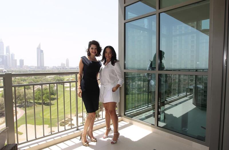 Ranya Khalil, right, and Sara Alemzadeh wear designer dresses which they offer to their clients. Jeffrey E Biteng / The National