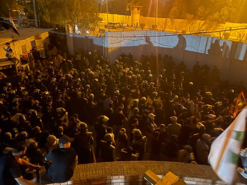 Protesters gather next to the Swedish embassy in Baghdad.  Iraq condemned the torching of the embassy. AFP