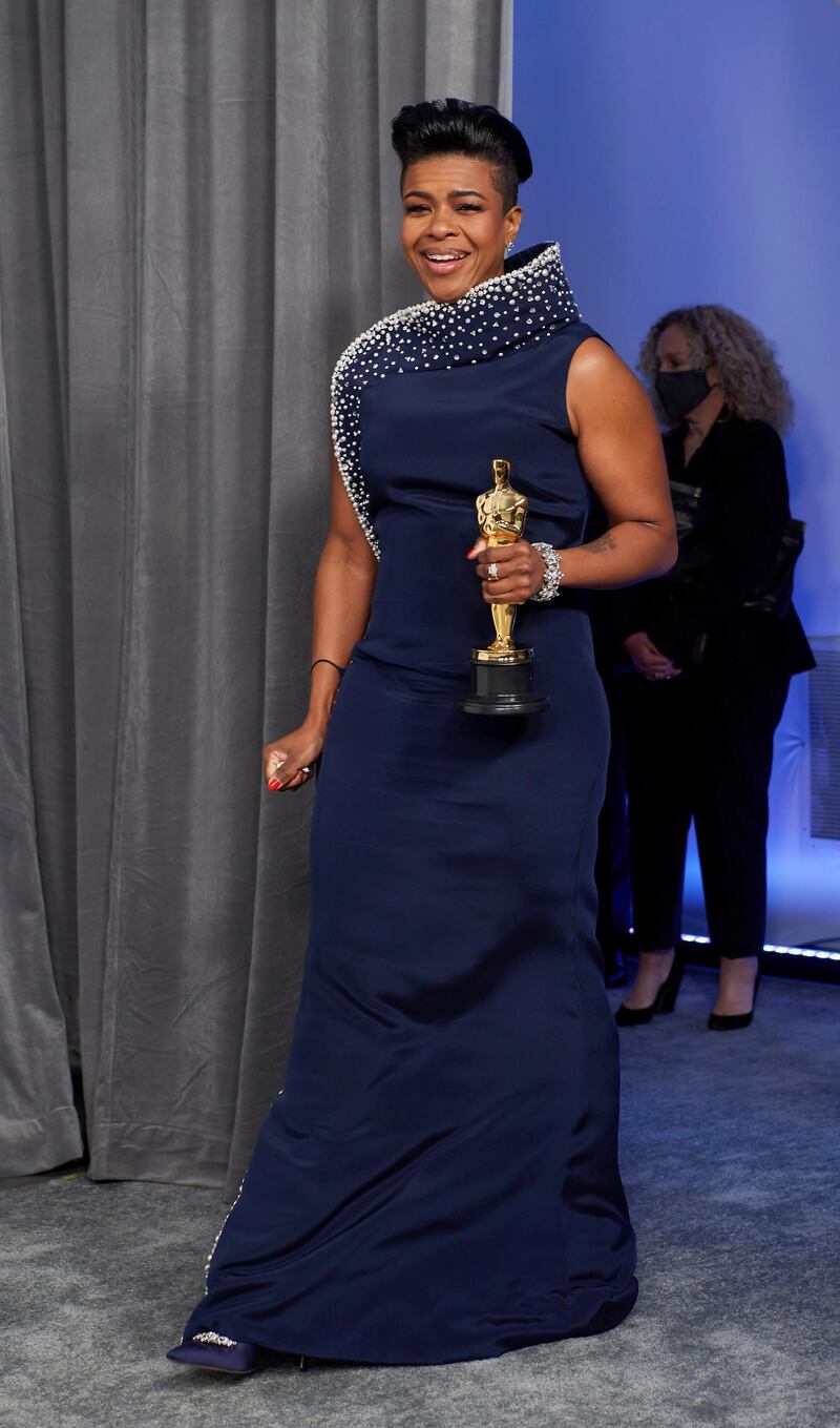 Mia Neal poses backstage with the Oscar for Make-Up and Hairstyling at the Academy Awards in Los Angeles, California. Reuters