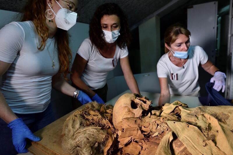 Researchers at the museum prepare to move the mummy to Policlinico, a hospital in Milan, to undergo a CT scan.