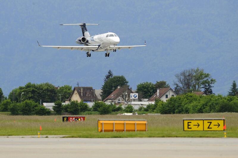 Business jet Embraer Legacy 500 lands at Geneva Airport. The Brazilian plane maker looks well set to report strong fourth-quarter results. Alain Groscluade / AFP 

