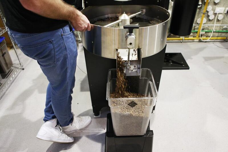 Dubai, UAE. September 7, 2015 - Head of coffee Anthony Papandreou prepares a batch of coffee beans in the roastery at the Sum of Us in Dubai, September 7, 2015. (Photo by: Sarah Dea/The National, Story by: Rachel Ingram/Arts and Life)