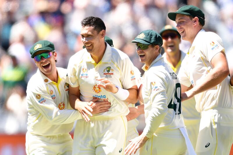 Scott Boland of Australia (2-L) celebrates with teammates after dismissing Ollie Robinso. EPA