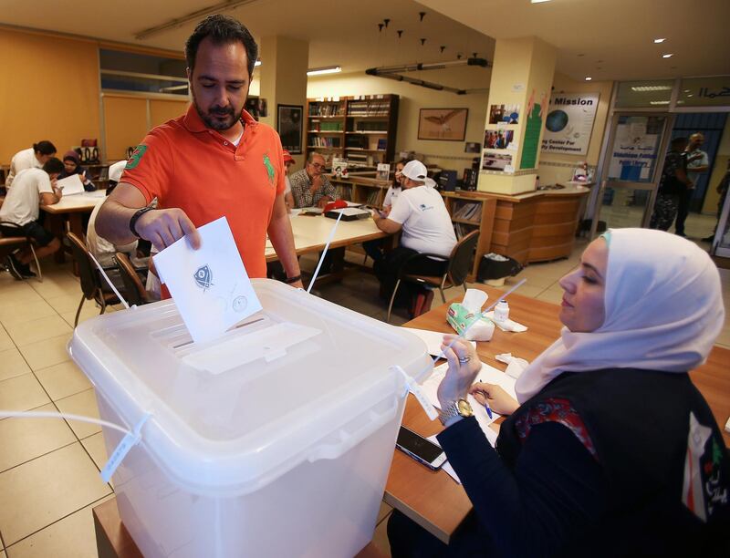 A man casts his vote at a polling station during the parliamentary election, in Sidon, Lebanon. Ali Hashisho / Reuters