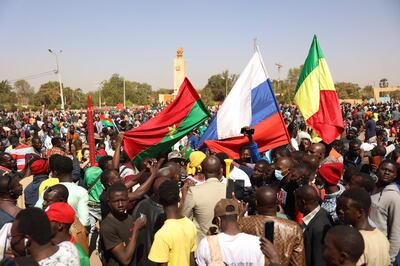Demonstrators gather in Ouagadougou to show support to the military while holding and waiving a Russian flag on October 25, 2022.  - In the aftermath of the coup d'etat in Burkina Faso which overthrew President Roch Marc Christian Kaboré, a demonstration in support of the putschists is scheduled for Tuesday in Ouagadougou where calm has returned after days of tension. 
Several dozen people converged early Tuesday on Place de la Nation in the center of the capital, where a demonstration in support of the military is scheduled for the morning.  (Photo by Olympia DE MAISMONT  /  AFP)