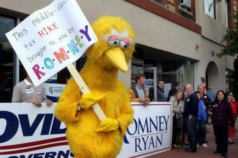 People dressed up as Big Bird have followed the Romney campaign trail. Jim Cole / AP Photo