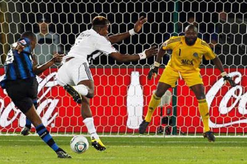 Inter Milan's Samuel Eto'o, left, scores the second goal against TP Mazembe during their Club World Cup final.