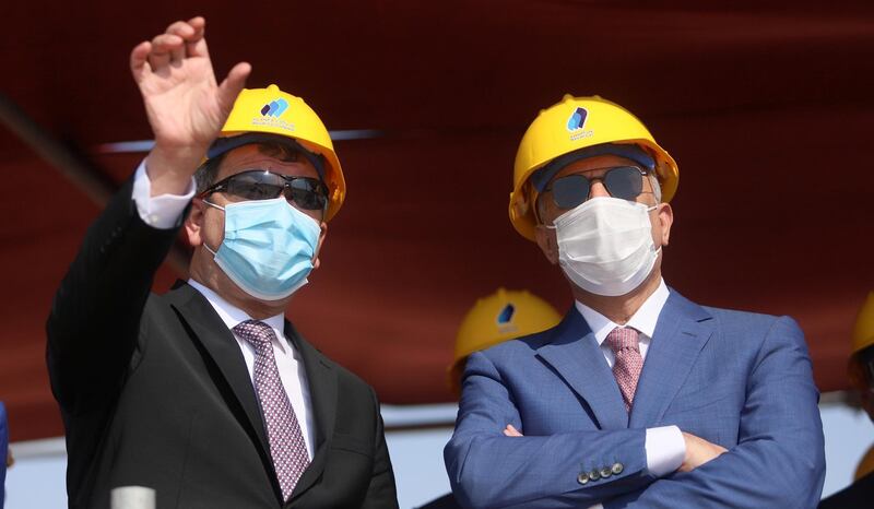 Iraqi Oil Minister Ihsan Abdul Jabbar gestures as he stands next to Iraq's Prime Minister Mustafa al-Kadhimi at the central station gas processing plant at Rumaila oilfield in Basra, Iraq, November 5, 2020. REUTERS/Essam Al-Sudani