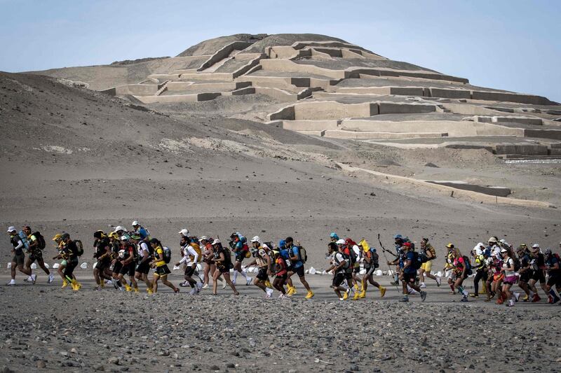 Competitors take part in the Marathon des Sables Peru first stage between Cahuachi and Coyungo in the Ica desert, 300 km south of Lima. Jean-Philippe Ksiazek / AFP Photo