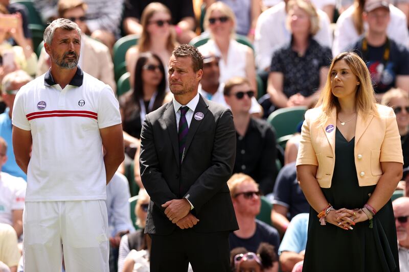 Former Wimbledon champions, from left: Goran Ivanisevic, Lleyton Hewitt and Marion Bartoli look on during the Centre Court Centenary ceremony. Getty Images