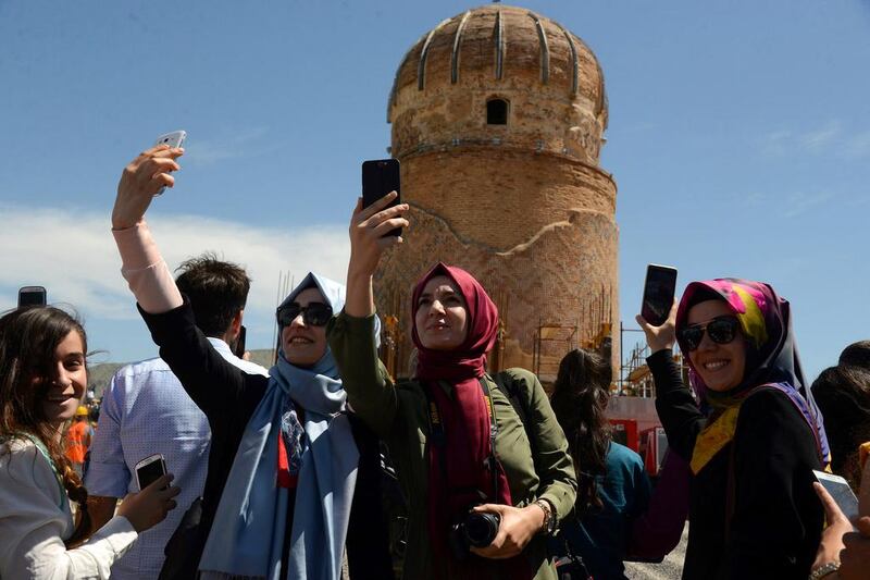 Locals take pictures of the tomb of Zenyel Bey in Batman, Turkey, as it is relocated to stave off the risk of flooding from a dam project. The tomb is a 15th century memorial to one of the key figures in the Ak Koyunlu tribe, which controlled much of eastern Anatolia and the Caucasus and vied for supremacy with the emerging Ottomans. Ilyas Akengin / Agence France-Presse