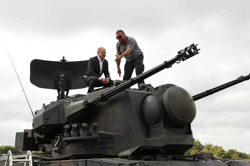 Mr Scholz being shown a Gepard anti-aircraft gun tank during his visit to the arms-maker Krauss-Maffei Wegmann. Germany promised Ukraine 30 Gepard self-propelled anti-aircraft tanks. Getty Images