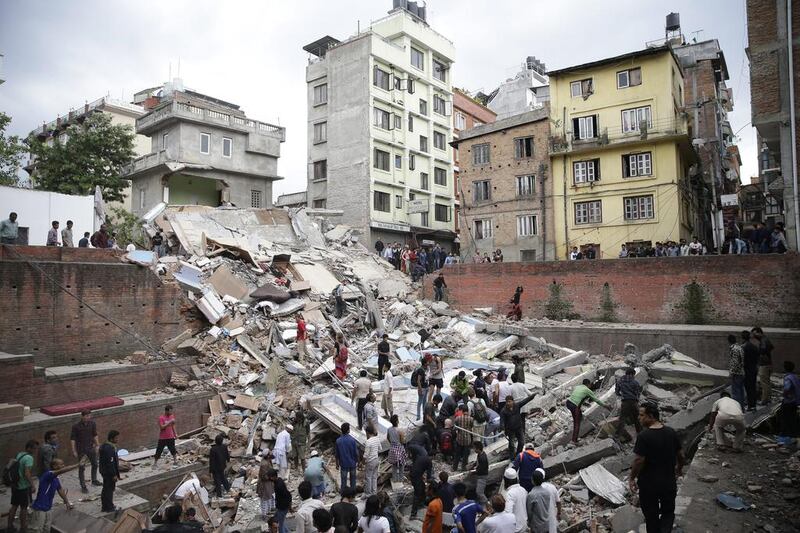 People search for survivors stuck under the rubble of a destroyed building, after an earthquake caused serious damage in Kathmandu, Nepal. Narendra Shrestha / EPA