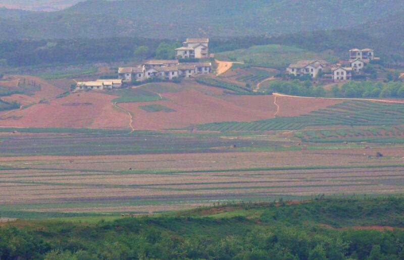 North Korea's border county of Kaepoong is seen from a South Korean observation post in Paju near the Demilitarized Zone (DMZ) dividing the two Koreas on May 17, 2019. North Korea is experiencing its worst drought in over a century, official media reported on May 17, days after the World Food Programme expressed "serious concerns" about the situation in the country. 
 / AFP / Jung Yeon-je
