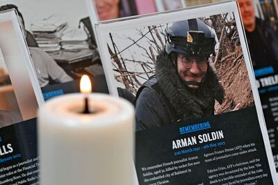 A tribute to AFP video journalist Arman Soldin at St Bride's Church in central London. AFP