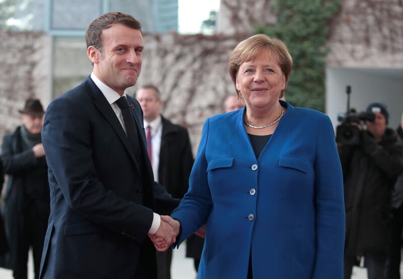 German Chancellor Angela Merkel welcomes French President Emmanuel Macron at the beginning of the Libya summit in Berlin, Germany, January 19, 2020. REUTERS/Axel Schmidt