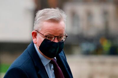 Britain's Chancellor of the Duchy of Lancaster Michael Gove arrives at the Whitehall entrance of the Cabinet Office in central London on December 21, 2020. The British prime minister was to chair a crisis meeting on December 21 as a growing number of countries blocked flights from Britain over a new highly infectious coronavirus strain the UK said was "out of control".  / AFP / Tolga Akmen
