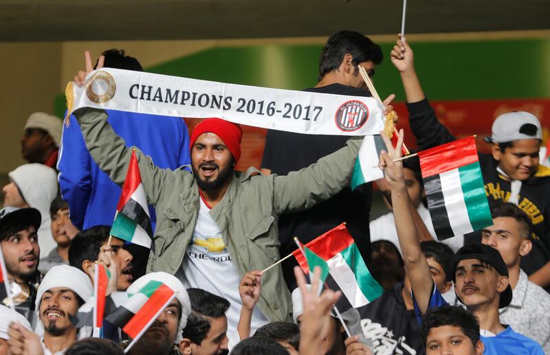 Al Jazira fan holds up a banner before the match. Reuters