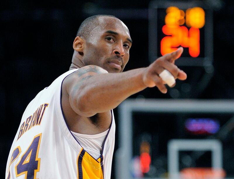 Kobe Bryant points to a player behind him after making a basket in the closing seconds against the Orlando Magic in Game 2 of the NBA basketball finals in Los Angeles in 2009. AP Photo