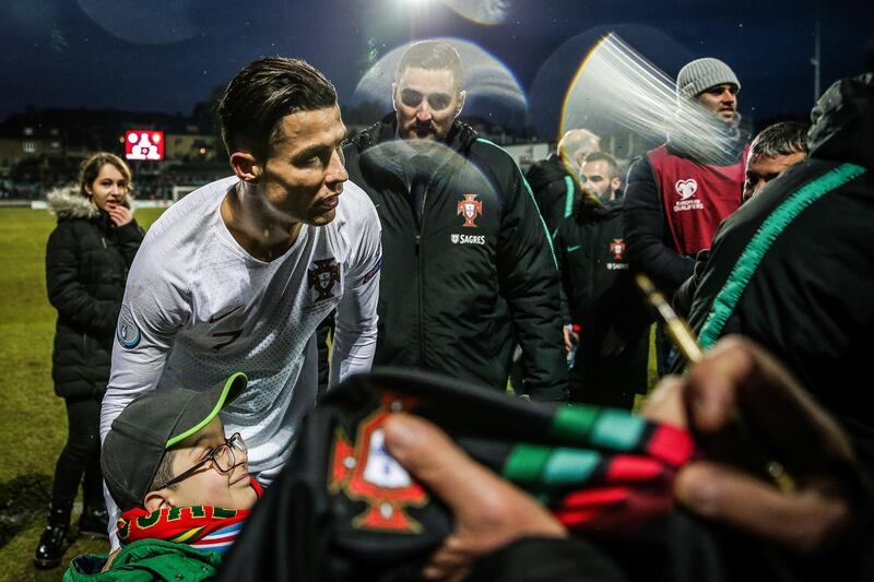 Portugal's Cristiano Ronaldo celebrates with fans. EPA