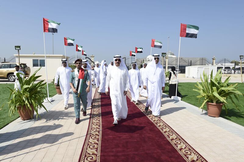 UMM AL QAIWAIN, 2nd November, 2017 (WAM) -- H.H. Sheikh Saud bin Rashid Al Mu'alla, Supreme Council Member and Ruler of Umm Al Qaiwain, on Thursday raised the national flag at Al Khor Park in Umm Al Qaiwain on the occasion of Flag Day, which coincides with the 12th anniversary of President His Highness Sheikh Khalifa bin Zayed Al Nahyan's accession to the Presidency of the UAE. He was accompanied by H.H. Sheikh Rashid bin Saud bin Rashid Al Mu'alla, Crown Prince of Umm Al Qaiwain. WAM