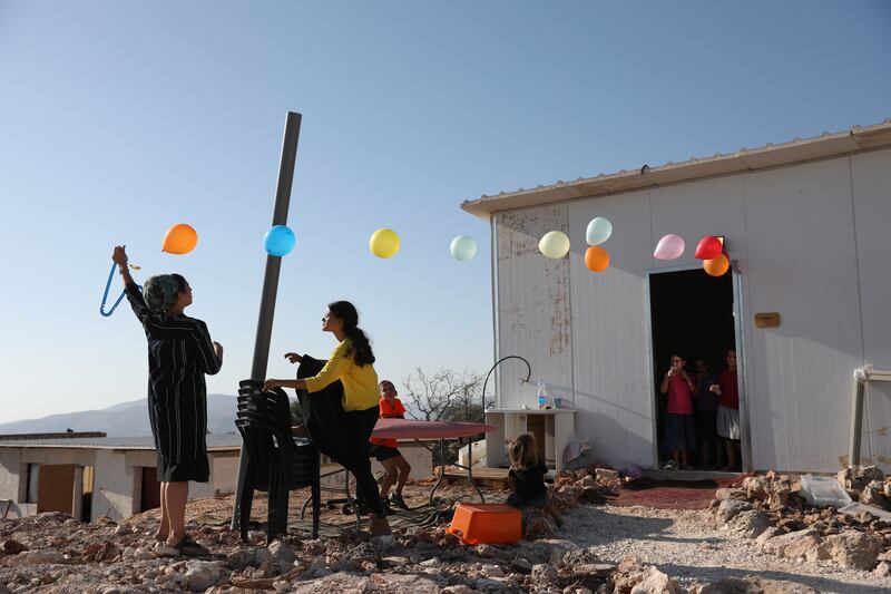 Israeli settlers from the Weinberger family celebrate a birthday at their house in the illegal outpost settlement of Eviatar, near the Palestinian village of Beita in the occupied  West Bank. The settlers' families agreed with the government on a temporary evacuation while they resolve the issue of the status of the land.