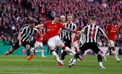 Newcastle United's Fabian Schar and Sean Longstaff in action as Manchester United's Wout Weghorst shoots at goal. Reuters