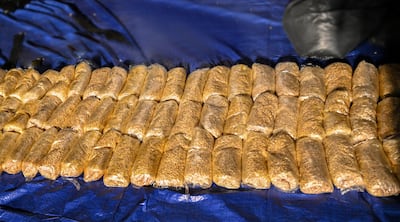 Sharjah Police have arrested 24 members of a criminal gang and seized 120kg of hashish and three million Captagon pills, valued at more than Dh23.5 million. Photo: Sharjah Police