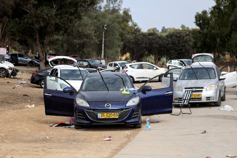 Cars are abandoned near where a festival was held before an attack by Hamas gunmen from Gaza that left at least 260 people dead. Reuters